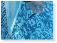 Blue dye swirling and dispersing in clear water