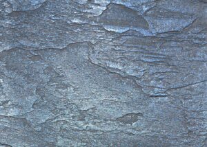 Close-up of blue-gray slate surface with natural layered texture and weathered finish