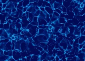 Bright blue light patterns rippling across dark water surface from above