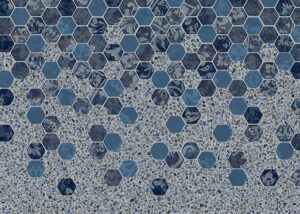 Hexagonal tile mosaic in shades of blue and gray with varied textured patterns