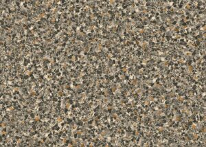Aggregate terrazzo surface with tan, brown, and cream stone chips in cement matrix