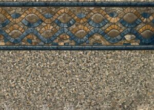 Decorative tile border with blue and tan mosaic pattern above textured concrete surface